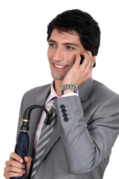 Μια γυαλισμένο επιχειρηματίας, μιλώντας στο κινητό του τηλέφωνο — Φωτογραφία Αρχείου
