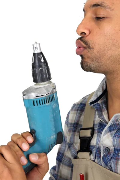 Man in profile with drill — Stock Photo, Image