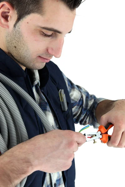 Closeup of young electrician at work — Stock Photo, Image