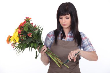 Florist cutting stems off flowers clipart
