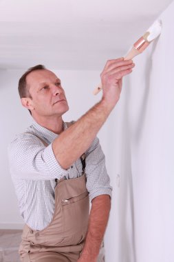 Painter painting wall clipart