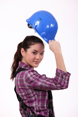 Woman raising her hard hat clipart