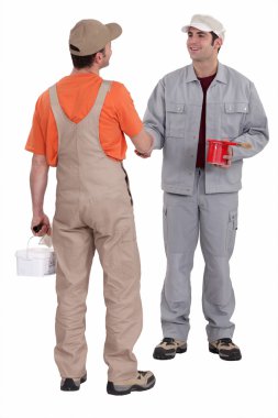 Duo of painters shaking hands clipart