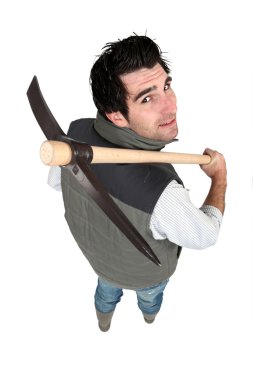 Man resting pick-axe on shoulder clipart