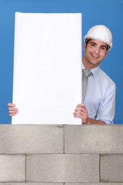 Man with white panel on wall clipart