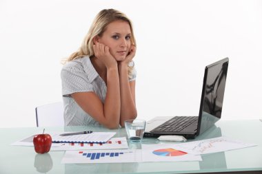 Woman sat at desk with glass of water and apple clipart