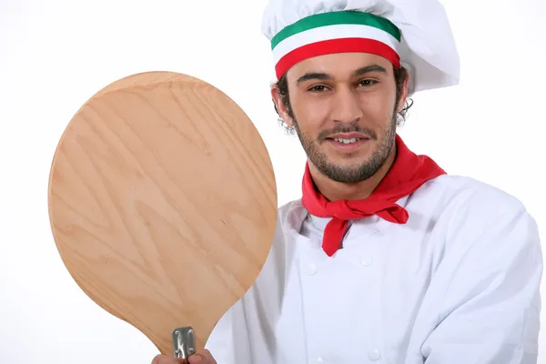 Young black pizza cook taking a spade — Stock Photo, Image