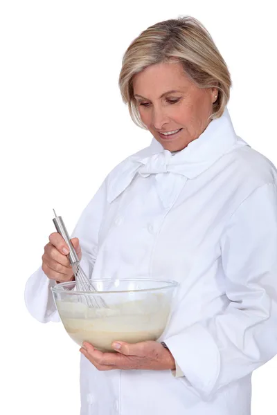 Cook mixing batter — Stock Photo, Image