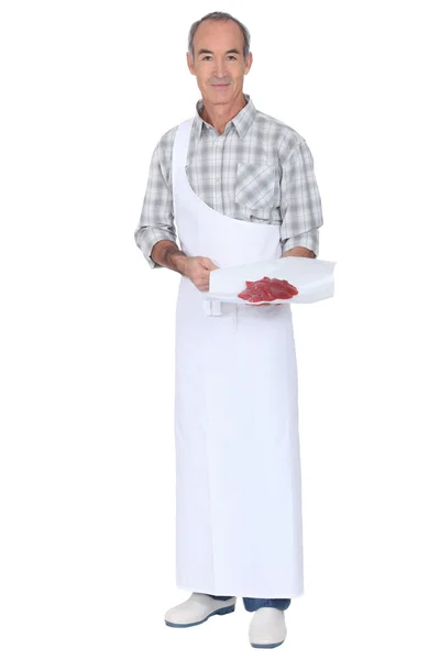 Butcher holding red meat — Stock Photo, Image