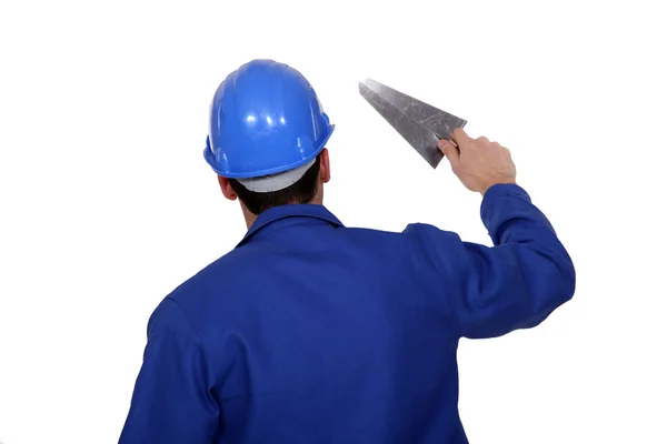 Arbetstagare som innehar en murslev — Stockfoto