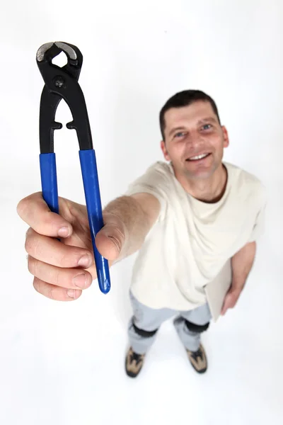 Man with a pair of pliers — Stock Photo, Image