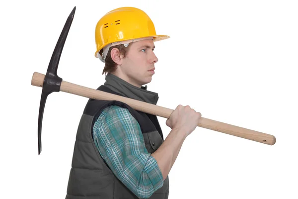 Craftsman carrying a pick on his shoulder — Stock Photo, Image