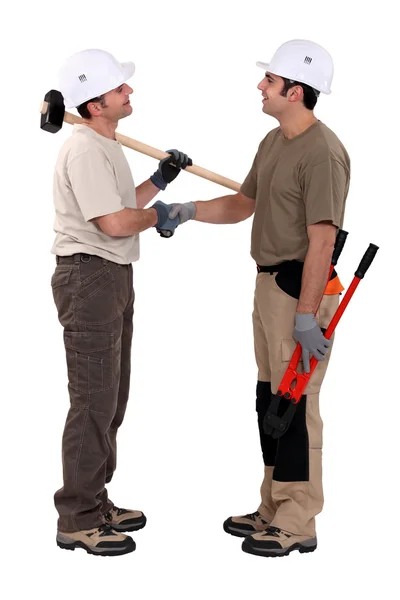 Two manual worker shaking hands. — Stock Photo, Image