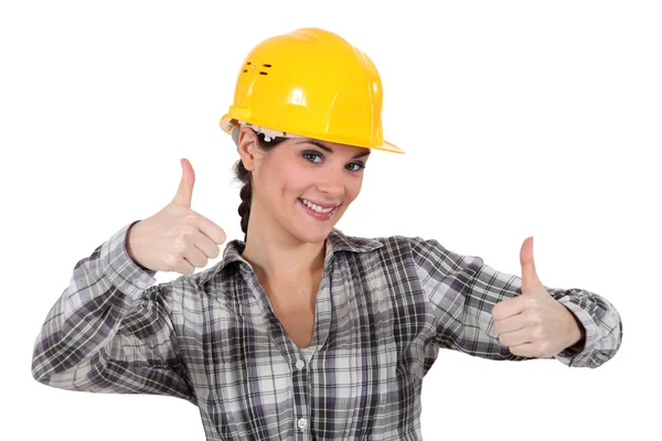 Smiling tradeswoman dando dois polegares para cima — Fotografia de Stock