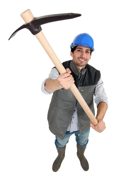 Man wielding pick-axe — Stock Photo, Image