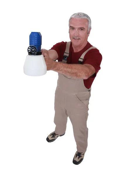 Tradesman holding a spray gun — Stock Photo, Image