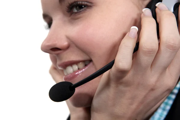 Brunette wearing telephone head-set — Stock Photo, Image