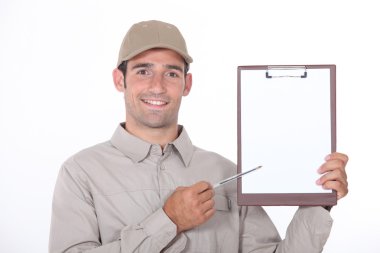 Delivery man showing a paper to sign clipart