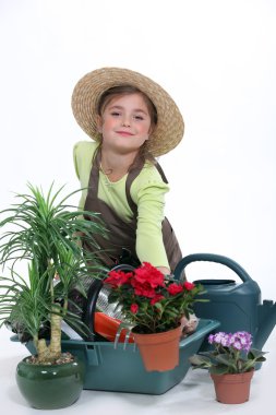 Child pretending to be a florist clipart