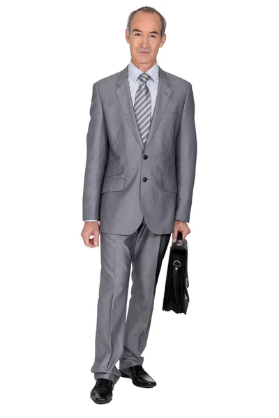 Full length shot of an older businessman with a briefcase — Stock Photo, Image