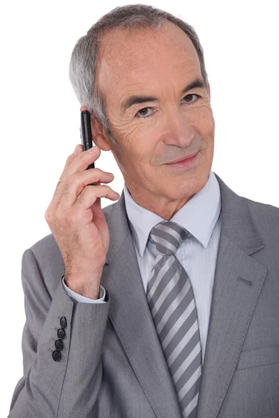 Starszy biznesmen z cellphone — Zdjęcie stockowe