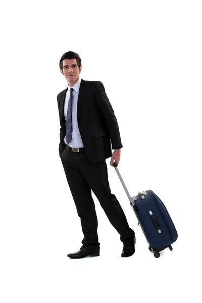 Een zakenman met zijn bagage. — Stockfoto