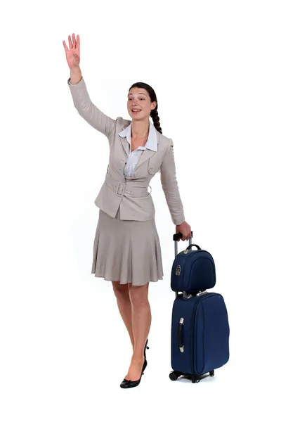 Woman waving goodbye — Stock Photo, Image