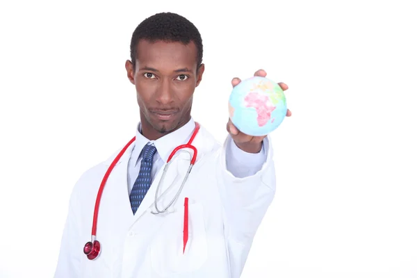 Doctor holding globe — Stock Photo, Image