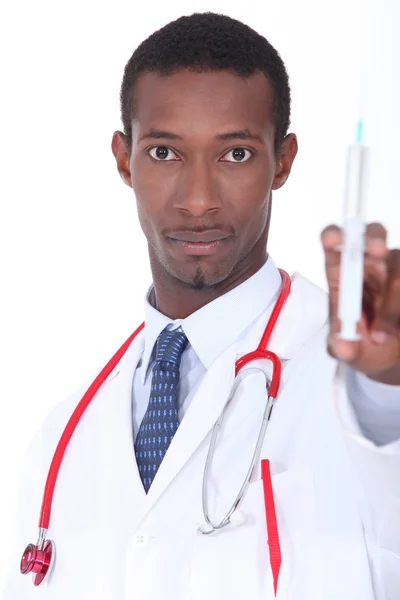 Man with syringe in hand — Stock Photo, Image