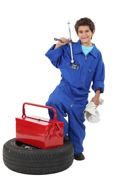 Young boy dressed as a mechanic — Stock Photo, Image