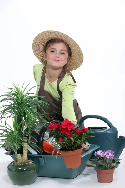 Criança fingindo ser uma florista — Fotografia de Stock