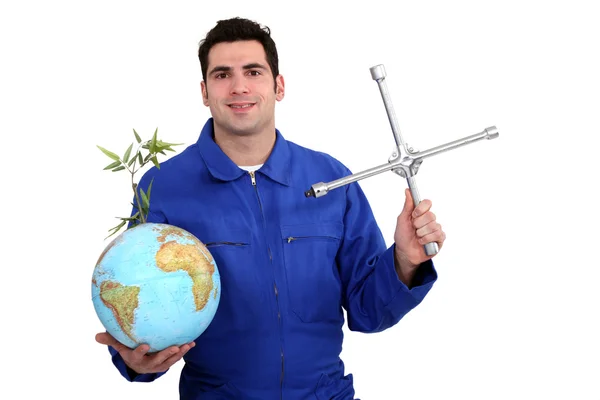 A mechanic with a globe. — Stock Photo, Image