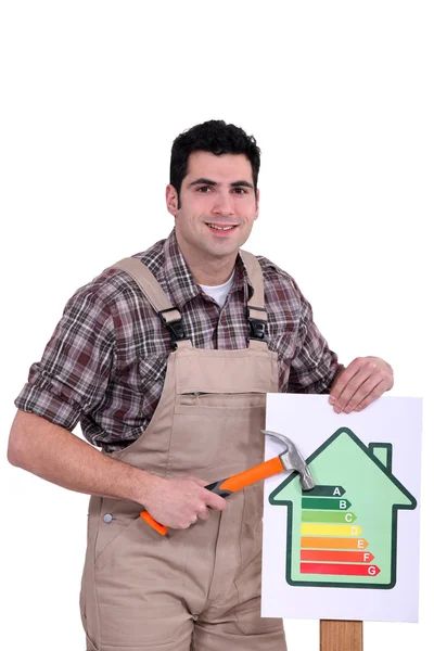 Man with an energy rating symbol — Stock Photo, Image