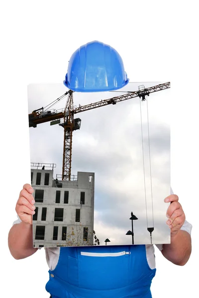 Blauwe kraag verstopt achter foto van de bouwplaats met kraan — Stockfoto