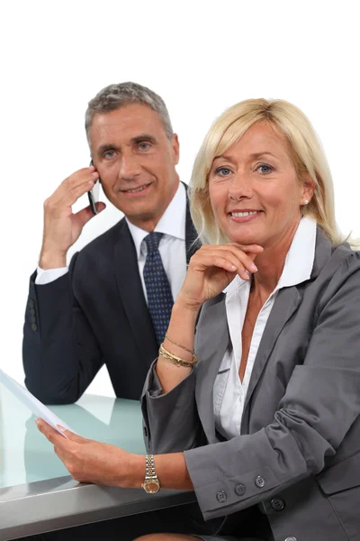 Senior business couple going over contract — Stock Photo, Image