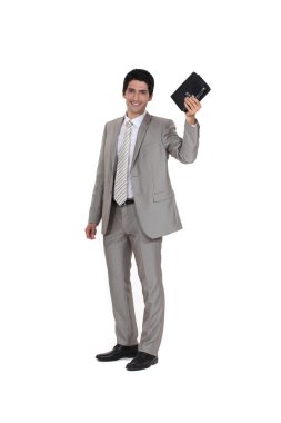Businessman holding his leather-bound agenda clipart