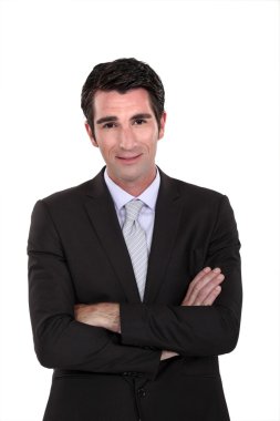 Portrait of a businessman with his arms crossed clipart