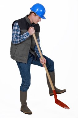 Labourer using a spade clipart