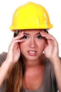 Construction worker with a headache clipart