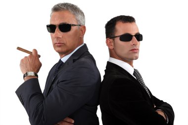 Powerful businessmen in sunglasses clipart