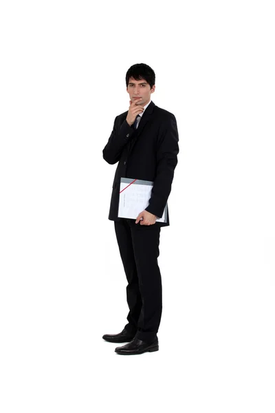 Young businessman with finger to his mouth isolated on white — Stock Photo, Image