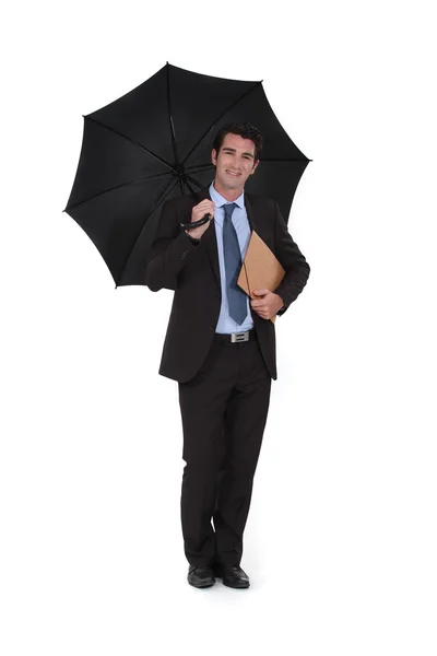 Επιχειρηματίας φορώντας μια ομπρέλα — Φωτογραφία Αρχείου