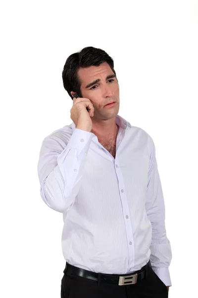 En sorglig affärsman via telefon. — Stockfoto