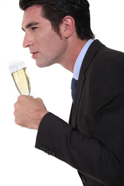 Zakenman met glas champagne — Stockfoto