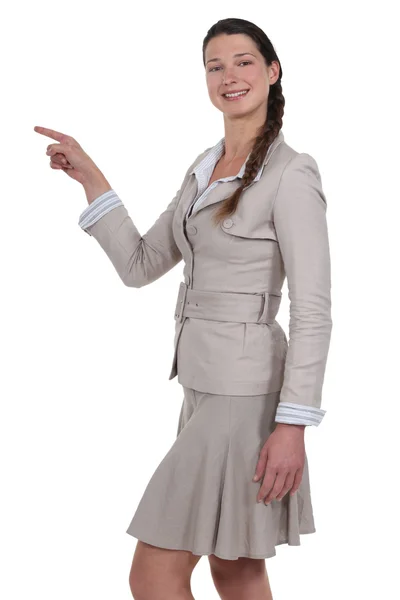 Businesswoman pointing at copy space — Stock Photo, Image