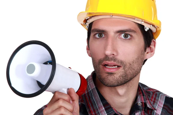 Young laborer with bullhorn in hand — Stock Photo, Image