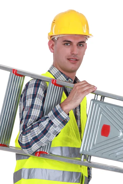 Laborer carrying ladder — Stock Photo, Image