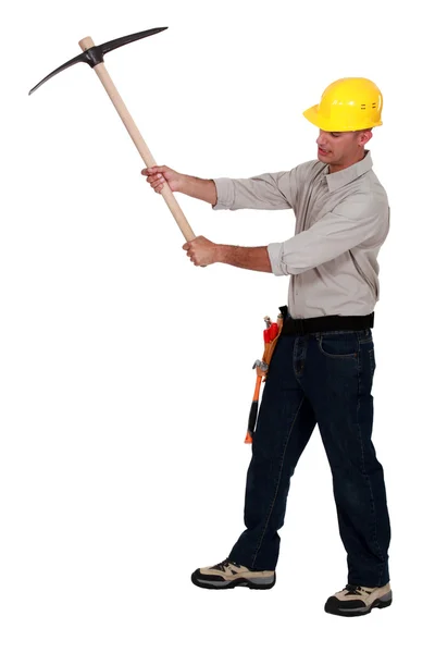 Man using pick-axe — Stock Photo, Image