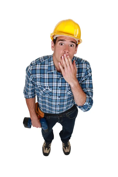 A stunned tradesman — Stock Photo, Image