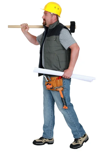 Tradesman carrying a mallet and a blueprint — Stock Photo, Image